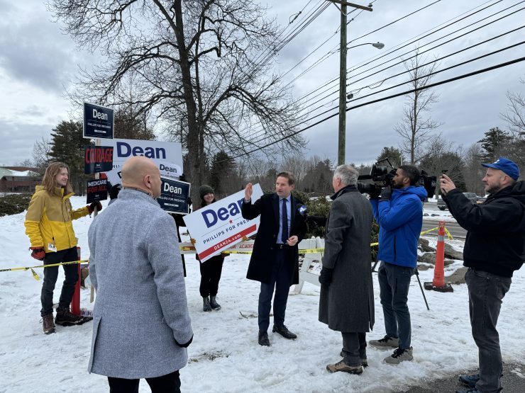 Dean Phillips with people campaigning for him outside a New Hampshire precinct on election day.